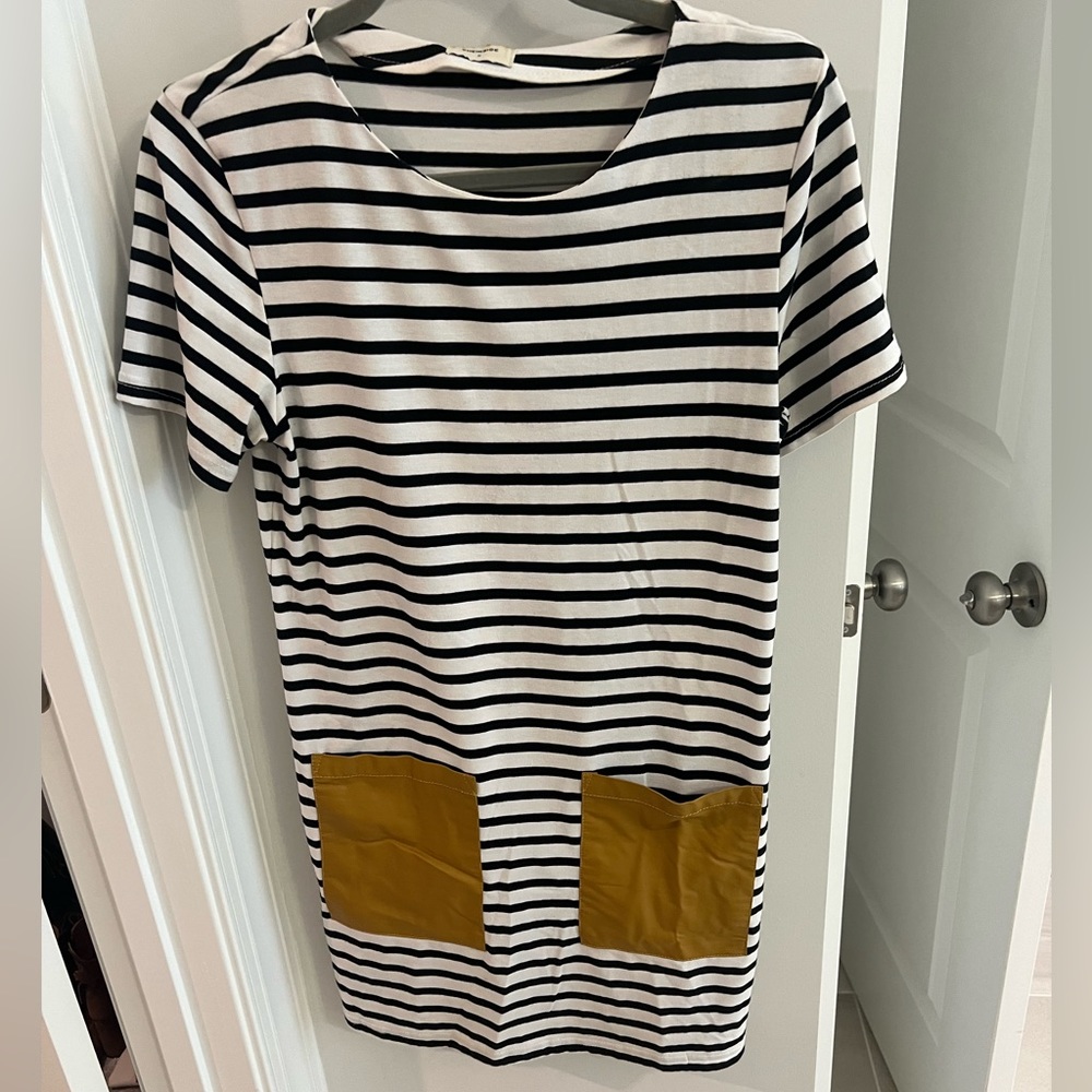 Black and white striped dress with tan faux leather pockets. So stylish!